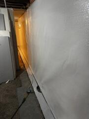 During: Our Foreman, Kingsley, and his crew worked hard to secure all the waterproofing products in the basement.