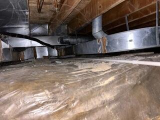 The crawl space was not properly sealed from the elements, introducing groundwater and high humidity.