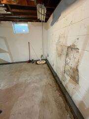 Our crew in the process of installing WaterGuard, installed at the perimeter, and SuperSump+