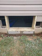 The crew expanded the crawl space access and framed it.