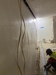 During: Our Foreman, Emmanuel, and his crew recommended securing several waterproofing products throughout the basement.