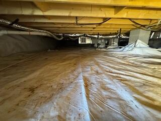 Old Encapsulation System done by another company. You can see it failed due to the mud stains on top of the barrier, due to a rip in the system.