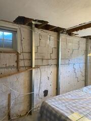 Foundation repair powerbrace system installed to support the foundation. Cracks were filled as well.