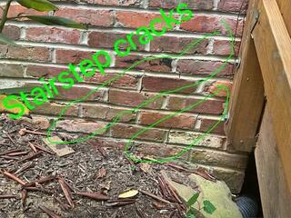 Stair step cracks indicate a foundation settlement problem