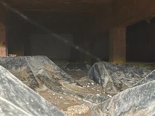 Water damaged vapor barrier.