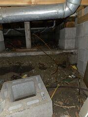 Pre-Install: Damp crawl space creates foul odor in home.