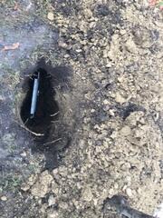 The earth anchor placed in and connected to the interior wall plate