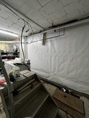 During: Our Foreman, Kingsley, and his crew worked hard to secure the products throughout the basement.