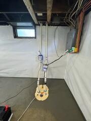 Sump Pump System
A TripleSafe sump pump system was installed to collect water from the drainage system and pump it safely away from the home. This is a key part of keeping the basement dry and protected.

CleanSpace Wall System
A durable wall vapor barrier is installed along the basement walls. CleanSpace helps create a brighter, cleaner appearance while helping direct wall moisture down into the drainage system.
