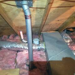 This ductwork is leaking conditioned air into the attic and is exposed to extreme summer heat, causing the cooled air inside the ducts to warm up before it ever reaches the rooms below.