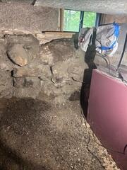 This damp crawl space needed a complete transformation to turn it into a dry, usable space, safe for the homeowner's utilities and belongings.