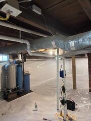 CleanSpace: A durable crawl space liner installed across the floor and walls to create a cleaner, brighter barrier between the home and the exposed ground.
Drainage Matting: Installed beneath the liner in key areas to help direct water below the encapsulation system.
Sump Pump System: Installed to collect and pump water out of the crawl space.