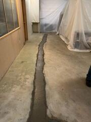 Concreted over leech line.