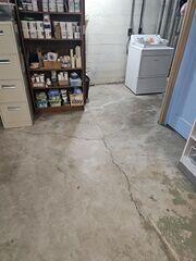 Crack in the floor caused by hydrostatic pressure.