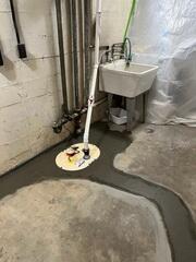 Sump pump system tied to the leech line and perimeter drainage system to pump out any water that may enter.
