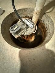 This old failing sump pump caused a lot of trouble for the homeowners.