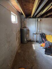 Before:  Our Design Speicalist, Dylan, recommended waterproofing the entire space.