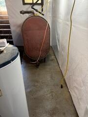 The CleanSpace Wall System was installed along the basement walls to help create a cleaner, brighter surface while working with the waterproofing system. When water enters through the foundation wall, CleanSpace helps direct it down into the drainage system rather than allowing it to spread across the basement floor or continue staining the wall surface.
Interior Basement Drainage System
The interior drainage system was installed along the basement perimeter to collect water at the base of the foundation wall. Once water enters the drainage system, it is directed to the sump pump system so it can be removed from the basement before reaching the main floor.
TrenchDrain
TrenchDrain was installed in areas where surface water needed to be captured before it traveled across the basement floor. This is especially helpful in utility areas, near openings, or in spots where water may not naturally reach the perimeter drainage quickly enough. The drain collects surface water and connects it to the waterproofing system.
Sump Pump System
The sump pump system was installed to remove water that collects in the basement. Water from the interior drainage and TrenchDrain is directed to the sump system, where it can be pumped out of the home and away from the foundation.
Exterior Discharge Line
The exterior discharge line carries water from the sump pump system to the outside of the home. This completes the waterproofing system by moving collected water away from the basement and foundation.