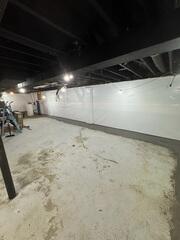 The CleanSpace Wall System was installed along the basement walls to help create a cleaner, brighter wall surface while working with the waterproofing system. When water enters through the foundation wall, CleanSpace helps direct it down into the drainage system rather than allowing it to continue staining the walls or spreading into the basement. The interior drainage system was installed around the perimeter of the basement to collect water at the base of the foundation wall. Once water enters the drainage system, it is directed to the sump pump system so it can be removed from the basement before it reaches the main floor.