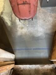 TrenchDrain was installed to collect surface water across an open floor area. This is especially helpful in spots where water can enter or travel across the floor before reaching the perimeter drainage system. The drain captures that water and directs it into the waterproofing system.