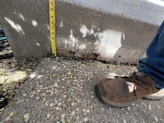 The slab in front of the entryway began sinking significantly by almost 6 inches.