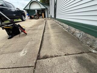 Before: Our Design Specialist, Nathan, recommended securing PolyLevel below the sinking slabs.