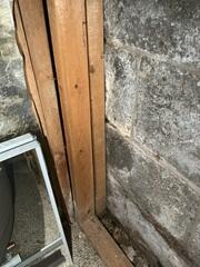 Damp basement wall in Howard County, MD with water stains and moisture concerns before basement waterproofing repairs.