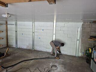 The channel anchors were secured to the wall and floor to stop movement.