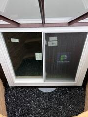 The open view of the exterior exit of the egress window.