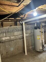 Pipe enters first basement from garage
