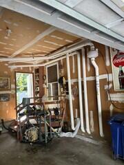 Radon fan mounted overhead in the garage