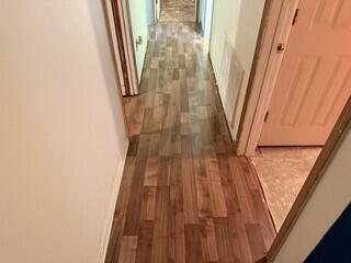 Damaged floors in hallway