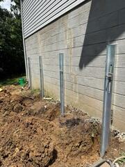 Our crew comes out to install the GeoLock wall anchors, stabilizing the foundation wall.
