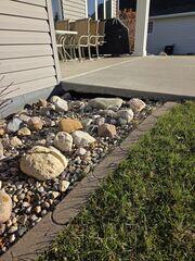 Before: Our Design Specialist, Dylan, noted the large voids growing on their back patio and recommended filling them.