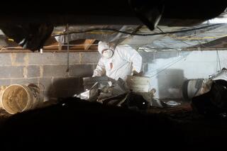 Our installation crew began preparing the crawl space for encapsulation.