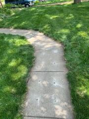 After our crew lifted and leveled the area eliminating the slope