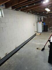 WaterGuard is placed along the perimeter of the floor and SuperSump+ is installed