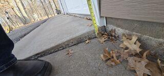 The sunken slab by the driveway