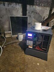 SaniDry Dehumidifier: Installed to help control basement humidity and reduce damp air after the waterproofing system collects and removes water.