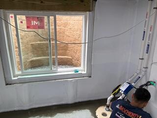 The RockWell Window Well and waterproofing system, consisting of WaterGuard and a TripleSafe Sump Pump