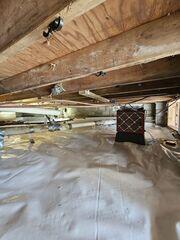 A SaniDry Sedona dehumidifier was installed to help control humidity and improve the overall conditions within the crawl space. The high-performance system removes excess moisture from the air while operating efficiently and automatically.