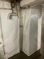 During: Our Foreman, Emmanuel, and his crew worked hard to secure all the products throughout the basement.