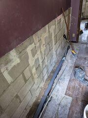 The edges of the floor were drilled and WaterGuard is placed down