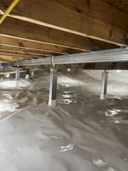 CleanSpace is a durable liner installed across the crawl space floor. It separates the home from the exposed ground, reduces the movement of moisture vapor into the space, and creates a cleaner and brighter area beneath the home.