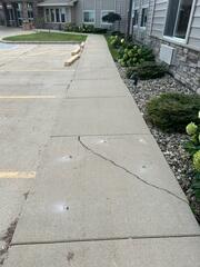 During: Our Foreman, Patrick, and his crew worked hard to lift all the damaged areas of the exterior concrete.