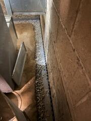 During: Our Foreman, Clay, and his crew worked hard to secure the products along the basement perimeter.