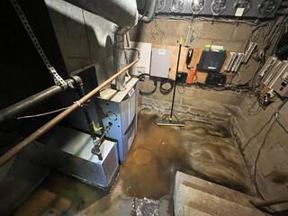 Before: Our Design Specialist, Ian, recommended waterproofing the entire basement.