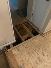 Hallway sub floor replacement. Main beam and sister joist replacement