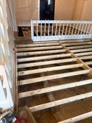 Sub floor replacement in progress. Main beam and sister joist replacement