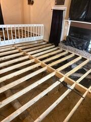 Sub floor replacement in progress. Main beam and sister joist replacement